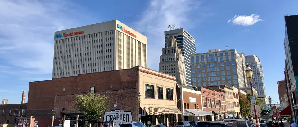 A downtown Winston-Salem street with office towers above the shopfronts